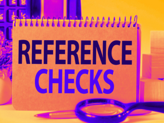 Notebook with 'Reference Checks' written on it, representing the importance of thorough reference verification in the recruitment process at ProducifyX.